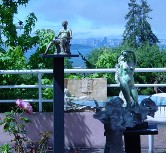 Photograph of several sculptures by the artist in an outdoor setting Photography, Color